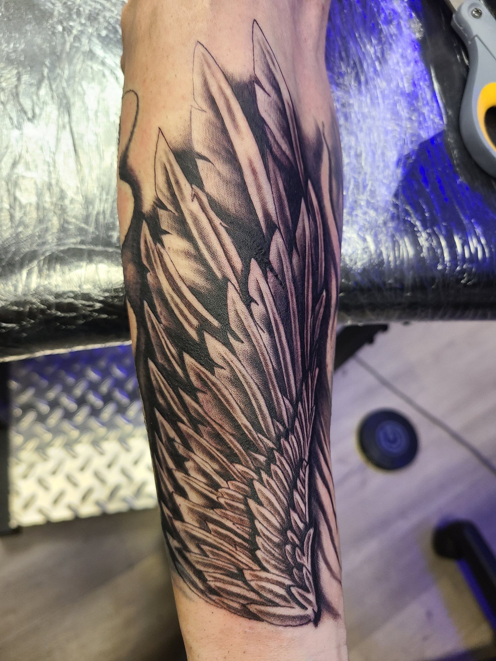 Black and grey wing tattoo by Social Suicide Tattoos in Pahrump, Nevada