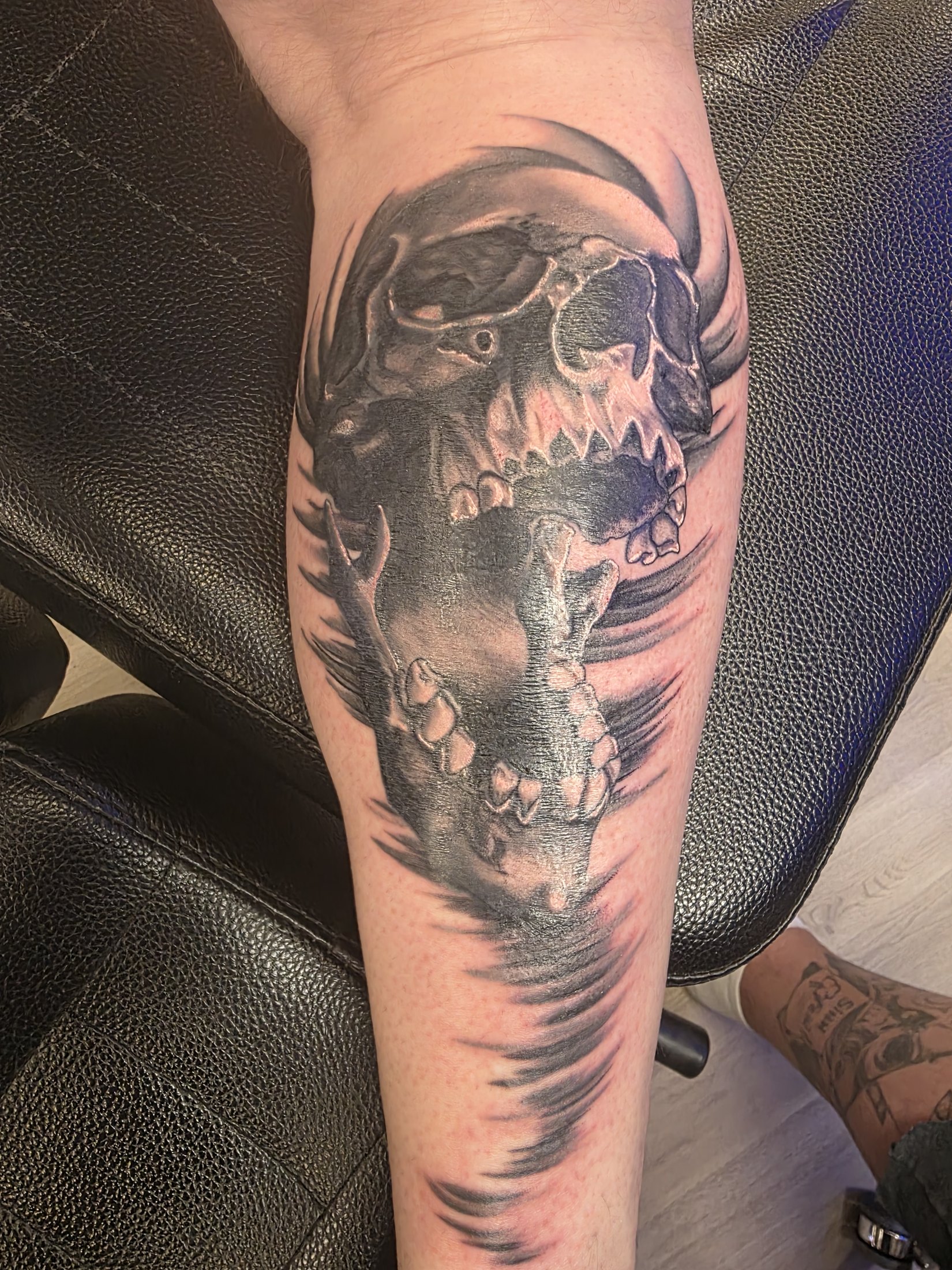 Black and grey skull coverup tattoo by Social Suicide Tattoos in Pahrump, Nevada