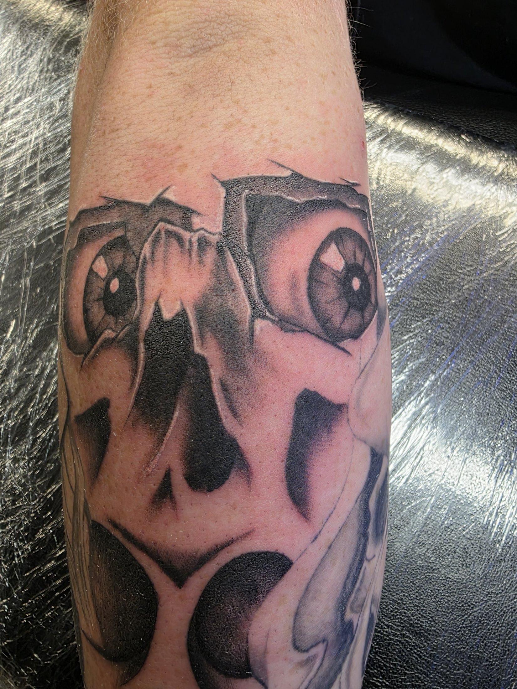 Close detail of black and grey skull tattoo by Social Suicide Tattoos in Pahrump, Nevada